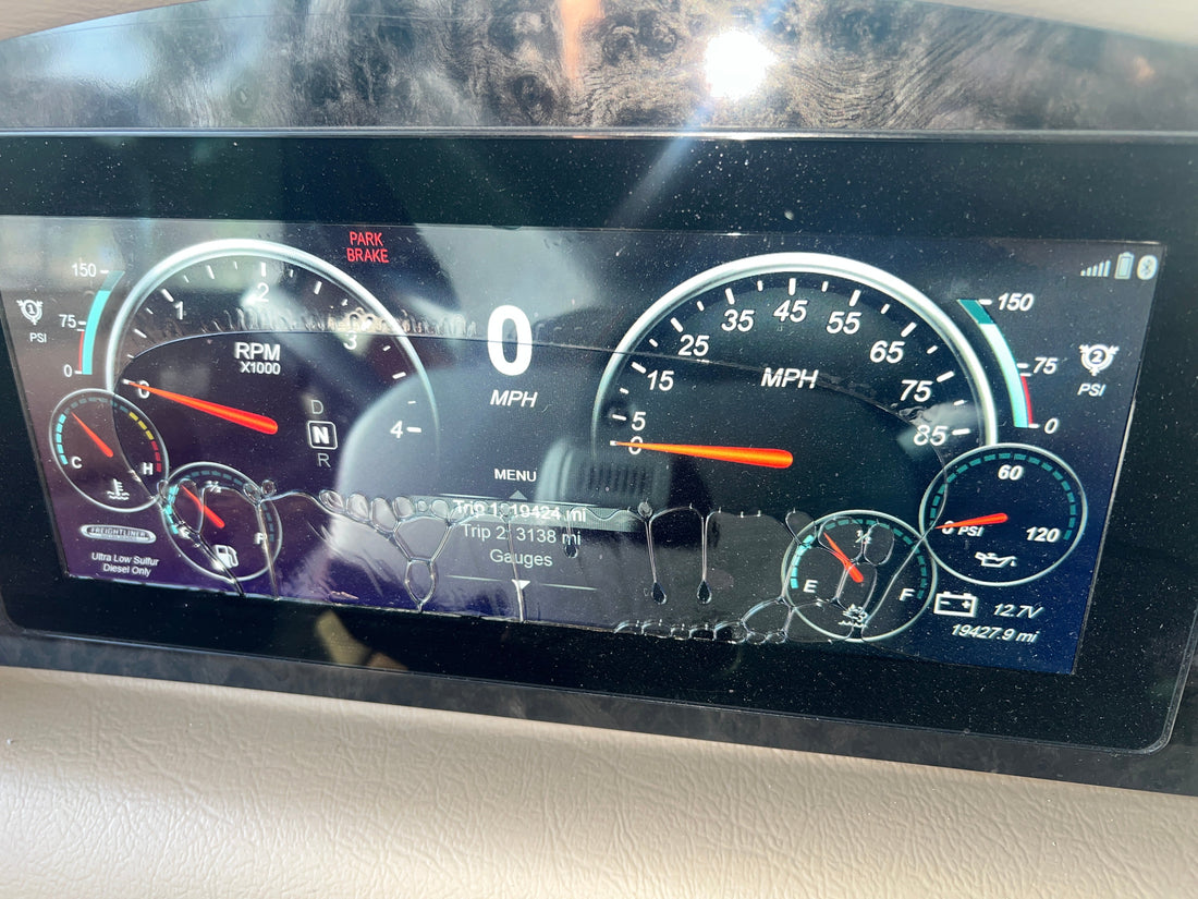 Freightliner OptiView 6913-00561-01 delaminated 12 inch Medallion Viper II dash screen on a Tiffin Newmar or Coachmen Class A motorhome — bubble pattern obstructing speedometer and warning lights, part 66-02439-000