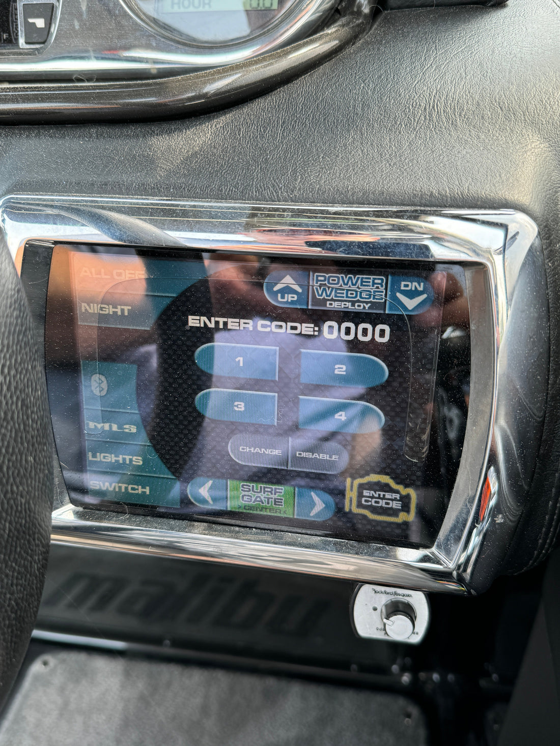 Delaminated 6.5 inch Malibu Wakesetter Medallion touch screen with a watery bubble across the glass
