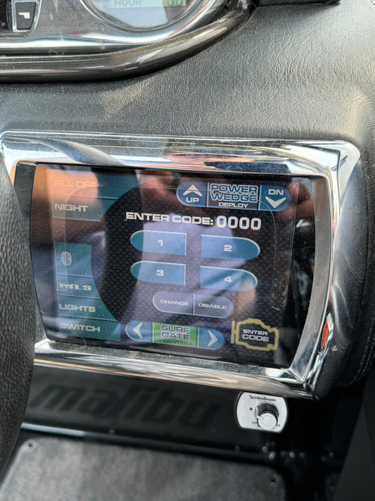 Delaminated 6.5 inch Malibu Wakesetter Medallion touch screen with a watery bubble across the glass