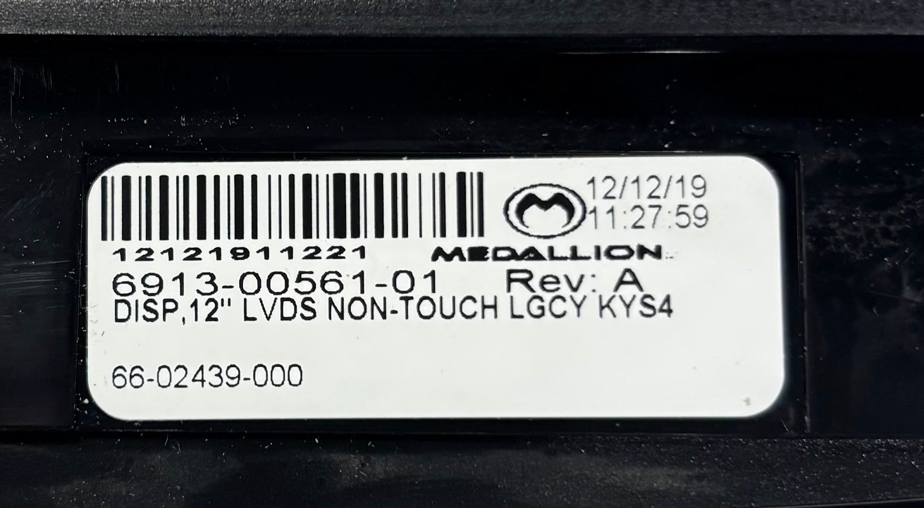 6913-00561-01 Optiview medallion delaminated 66-02439-000